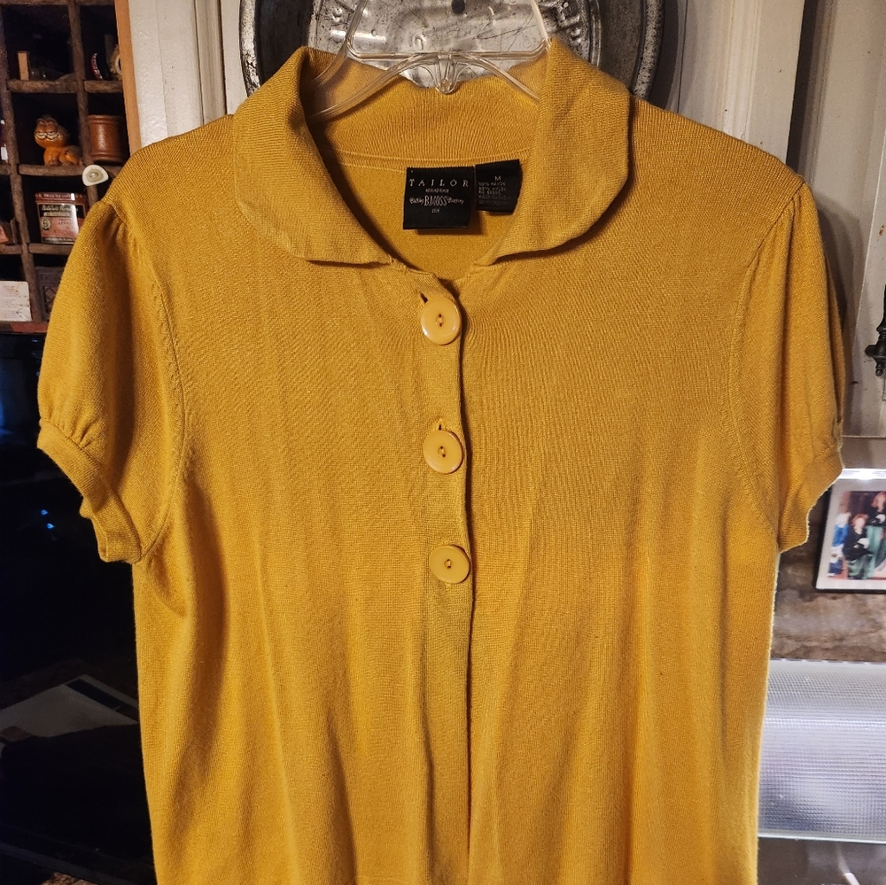 Gold 3 button-down short sleeve sweater. It's great to wear over a blouse.